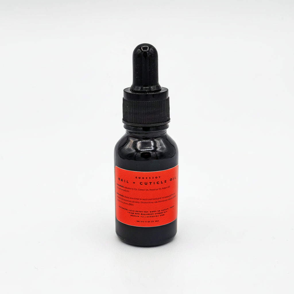 Black Glass Bottle with a red label of cuticle oil with a dropper on a white background