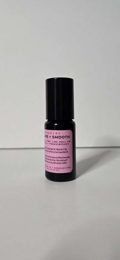 Skincare serum bottle with black cap and pink label on a white background