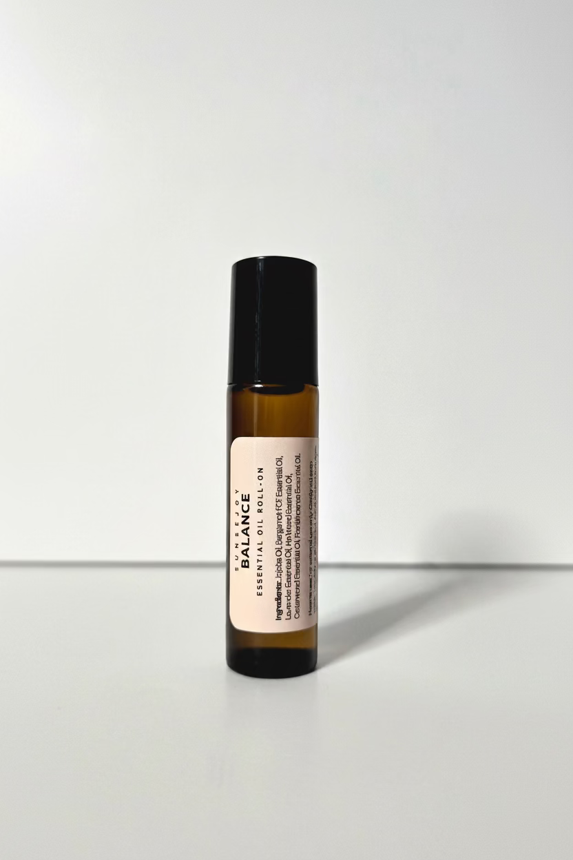 Roll-on bottle of Balance essential oil on a white background