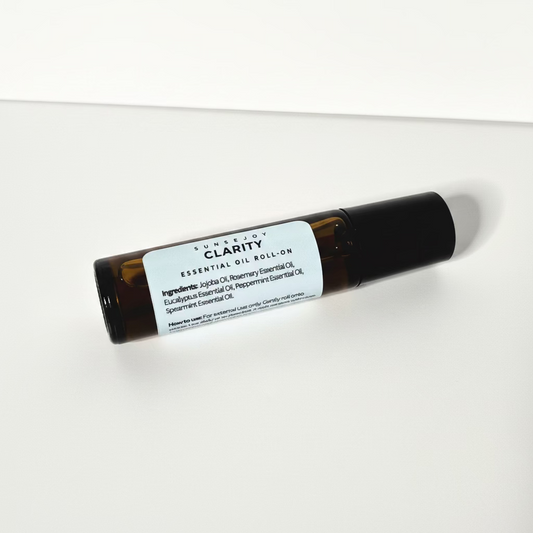 Essential oil roll-on labeled 'Clarity' on a white background