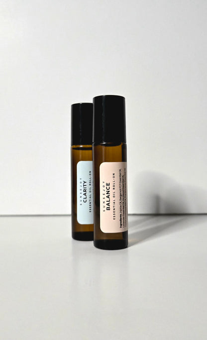 Two roller bottles labeled 'Clarity' and 'Balance' on a white background