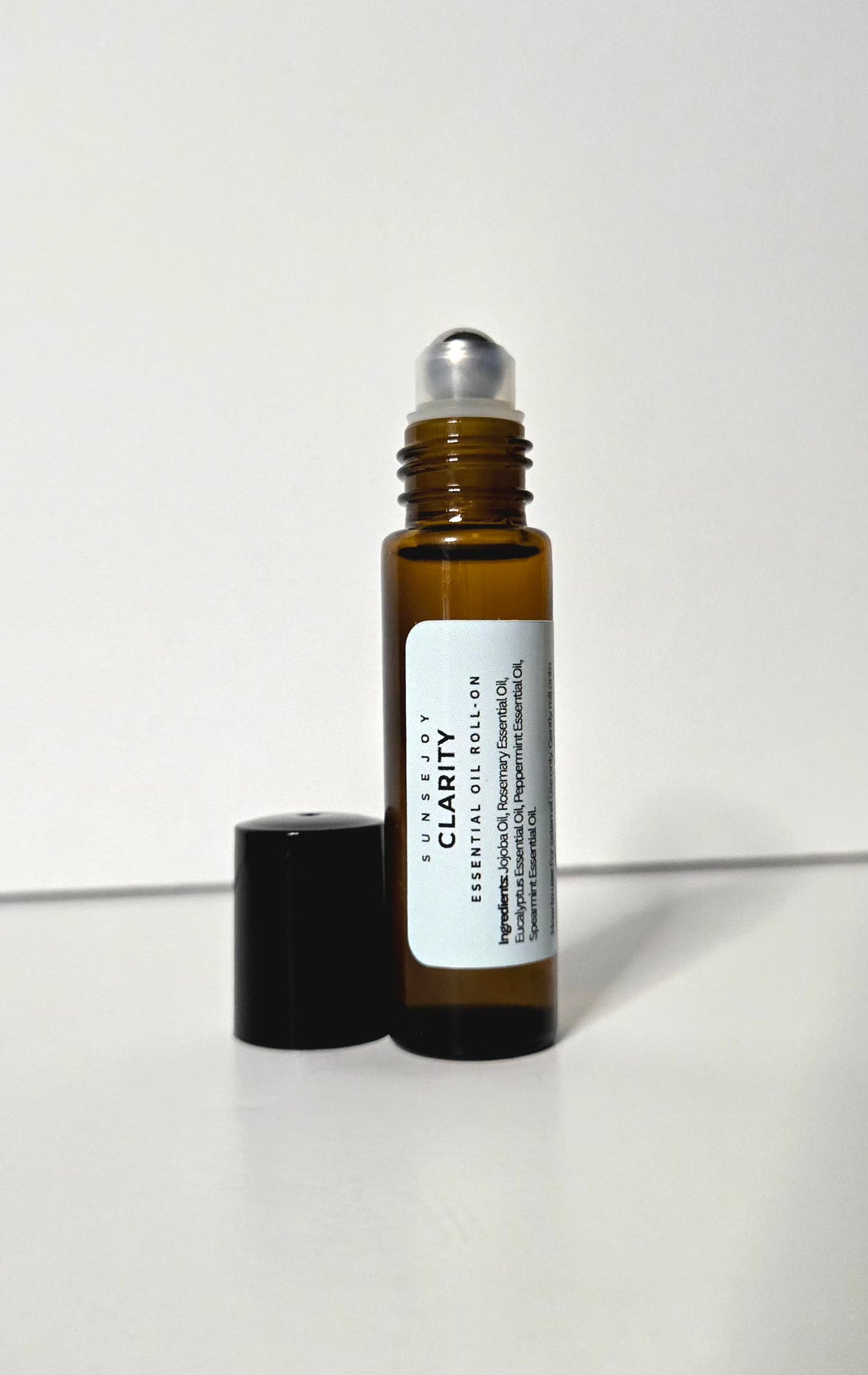 Roll-on bottle labeled 'Clarity' on a white background