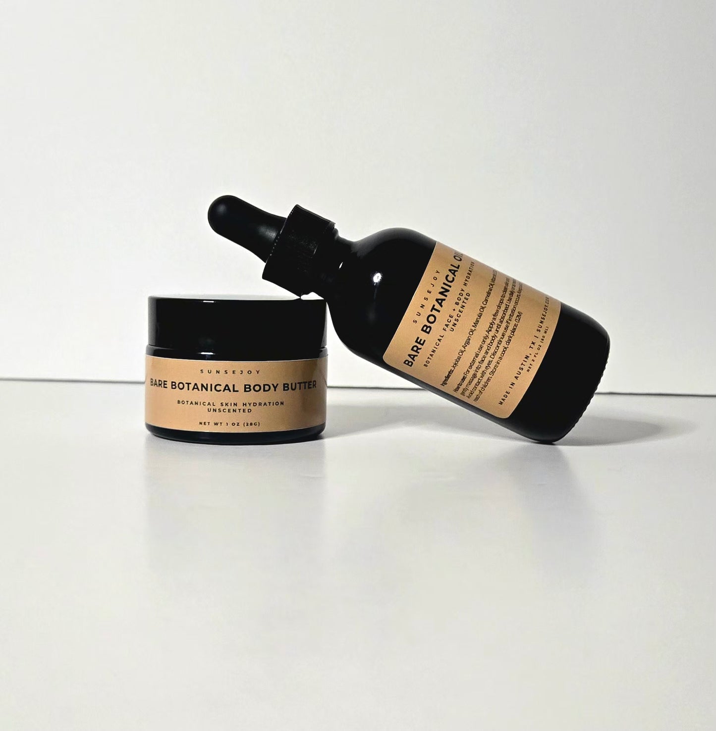 Bare Botanicals body butter and serum on a white background
