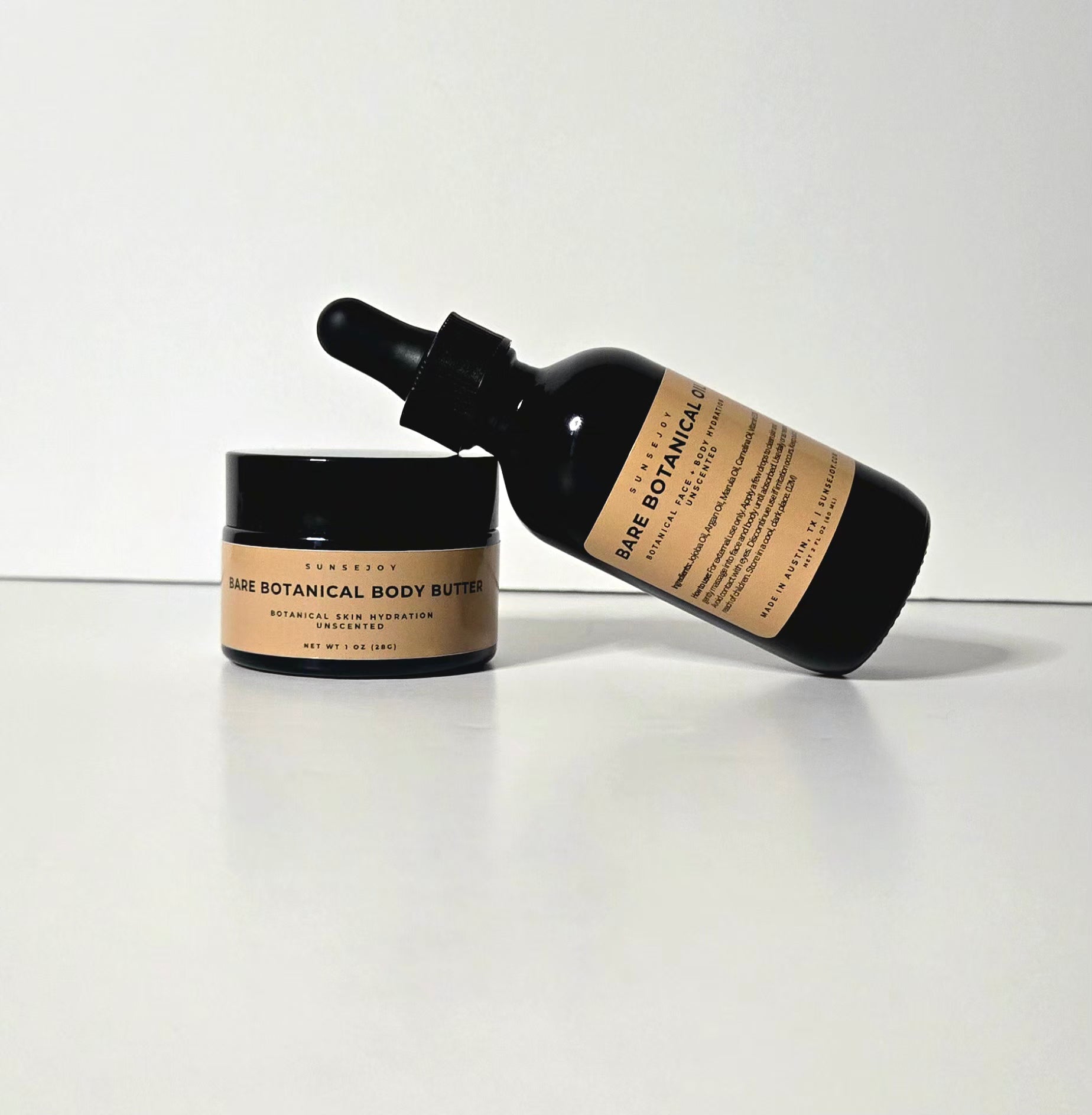 Bare Botanicals body butter and serum on a white background
