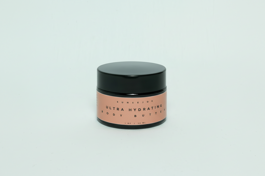 Black jar of ultra hydrating body butter with black lid on a light gray background