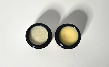Two black containers with beige contents on a white background