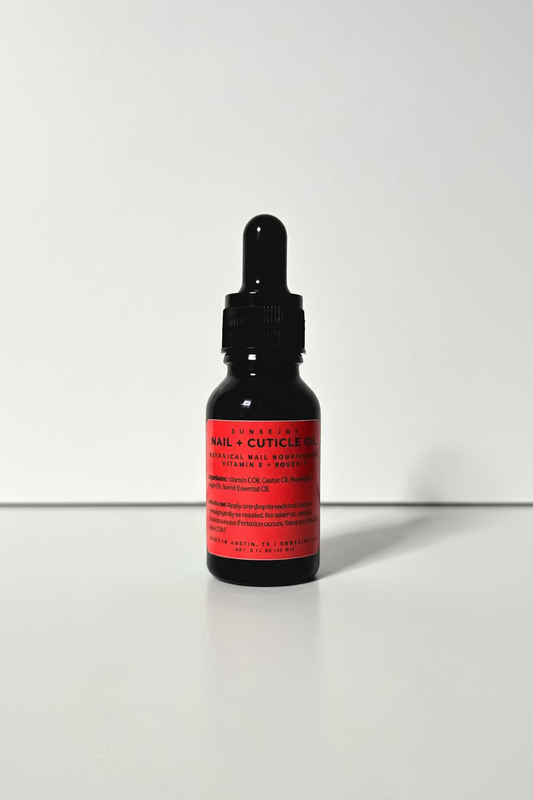 Black dropper bottle with red label on a white background